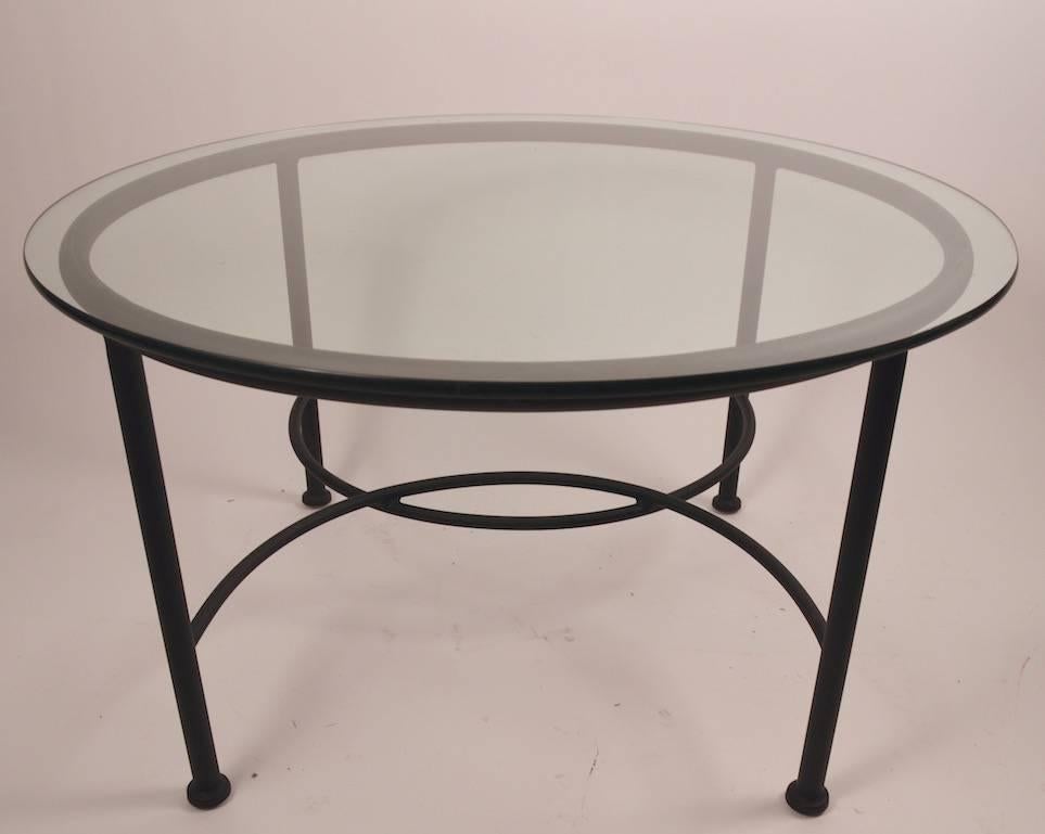 Pair of round glass top, aluminum base tables, by Brown Jordan. Suitable for indoor or outdoor use, slight loss to paint finish, normal and consistent with age. Priced and selling as a pair. Please view the other Brown Jordan items we have listed