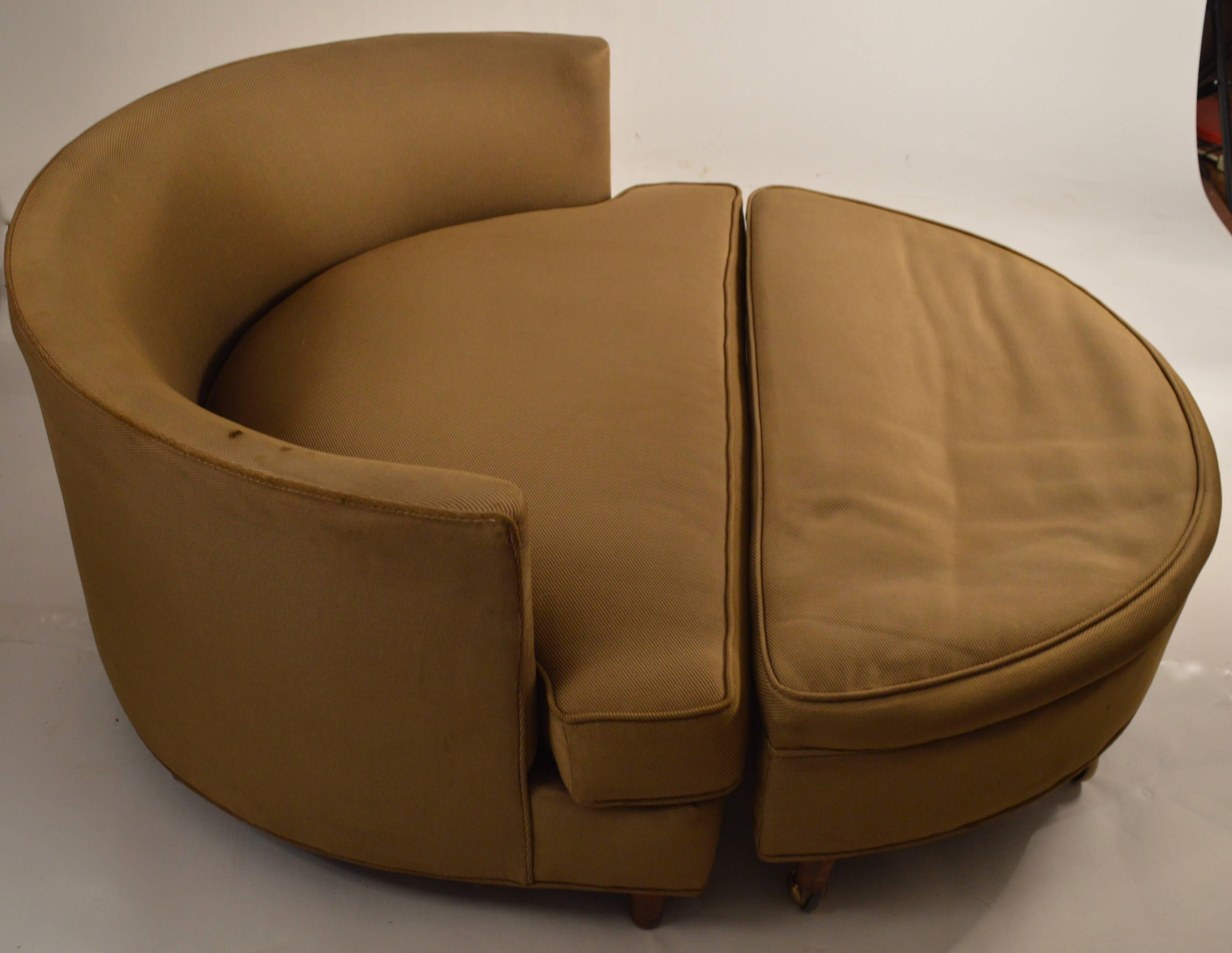 Semi-circular chair couples with original semi-circular ottoman to form circular seat. Extra wide to accommodate lounging for one or two. The fabric (original) shows wear and will need to be replaced. Dimensions for chair alone: 41