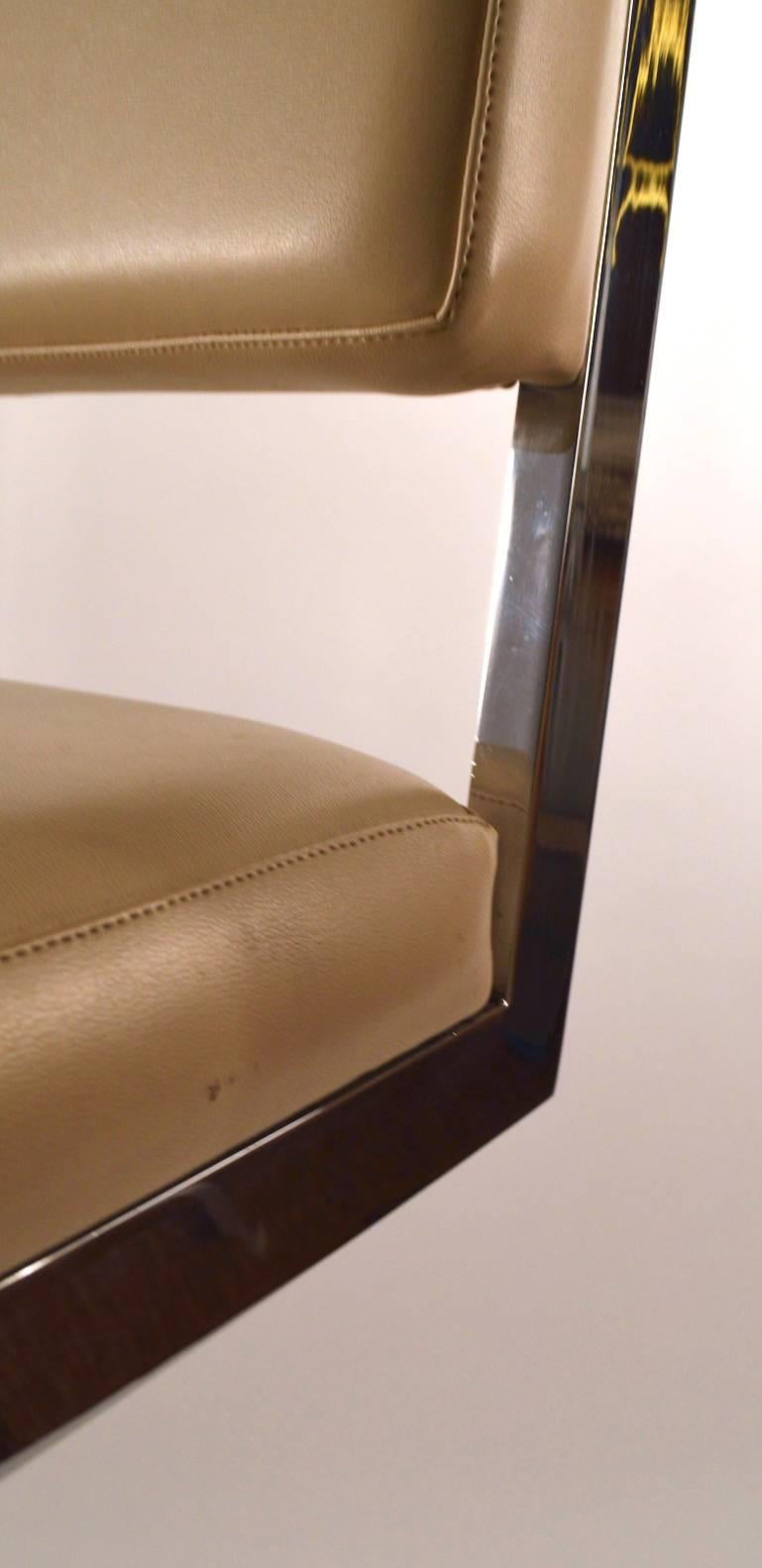 Tall stool with squared chrome frame, upholstered seat and back. Solid, sturdy, and clean, ready to use condition. Design attributed to Milo Baughman.