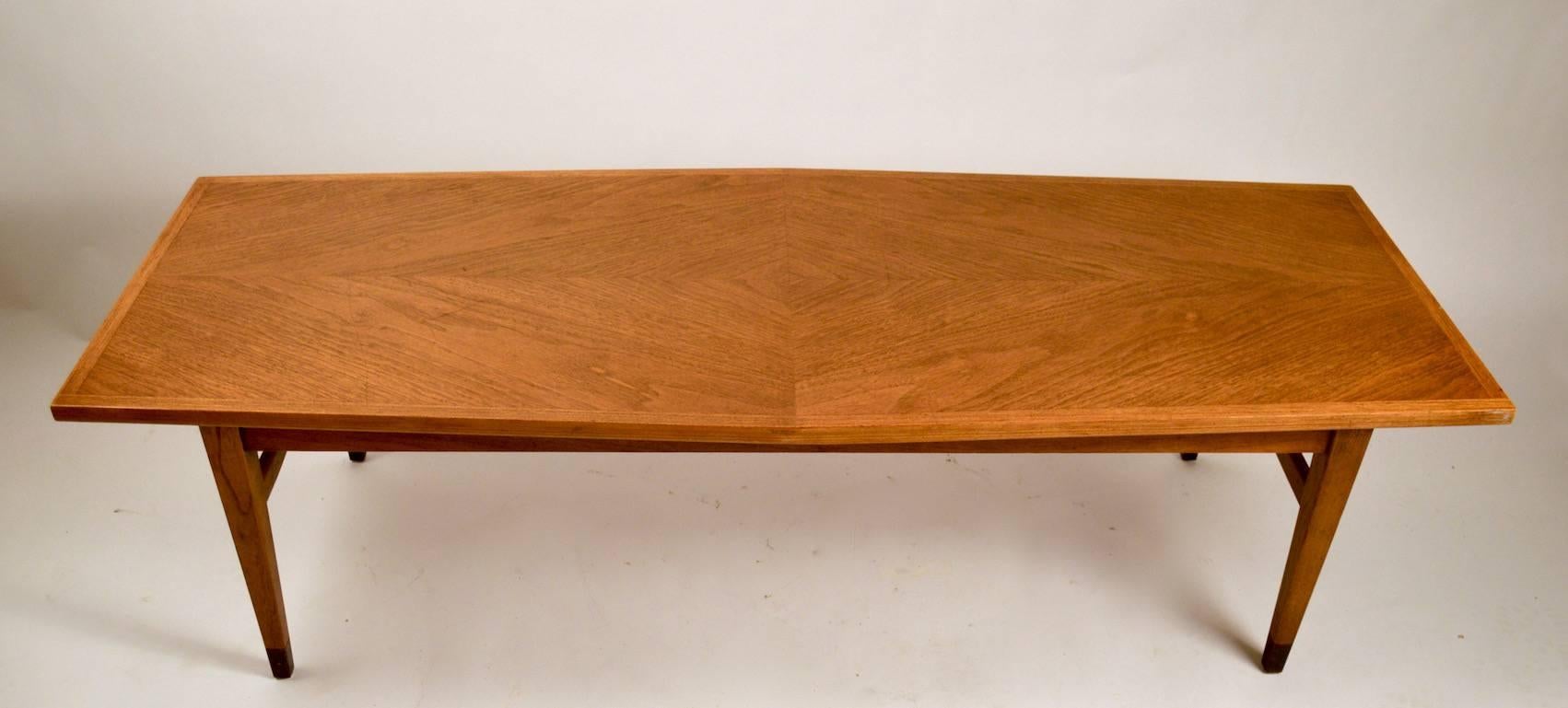 Classic Mid-Century coffee, cocktail table. Six side top, on tapering legs, architectural style and construction.