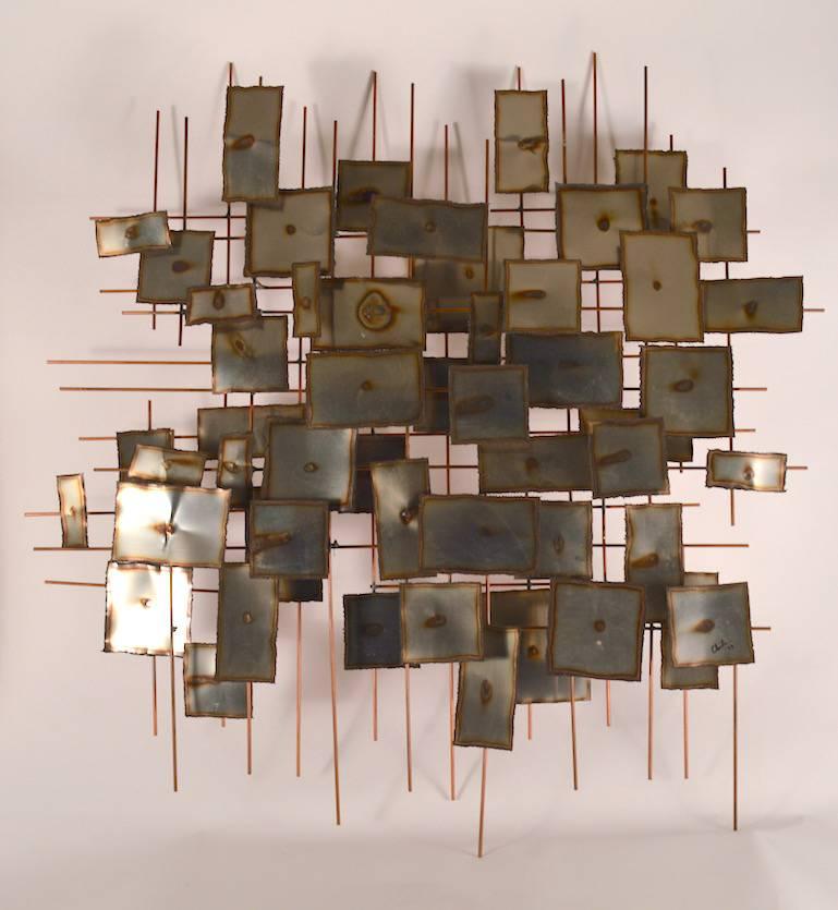 Nice Brutalist wall hanging, which features square torch cut panels mounted on wire superstructure. This sculpture is signed (illegible) and dated '73. Impressive scale period Brutalist decorative art.