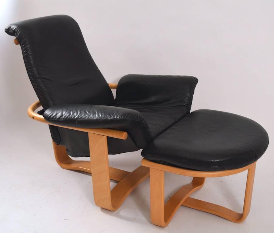 Nice clean manta chair and ottoman, by Ingmar Relling for Westnofa, Norway. Subtle black leather seat blonde wood frame. Measures: Ottoman 24