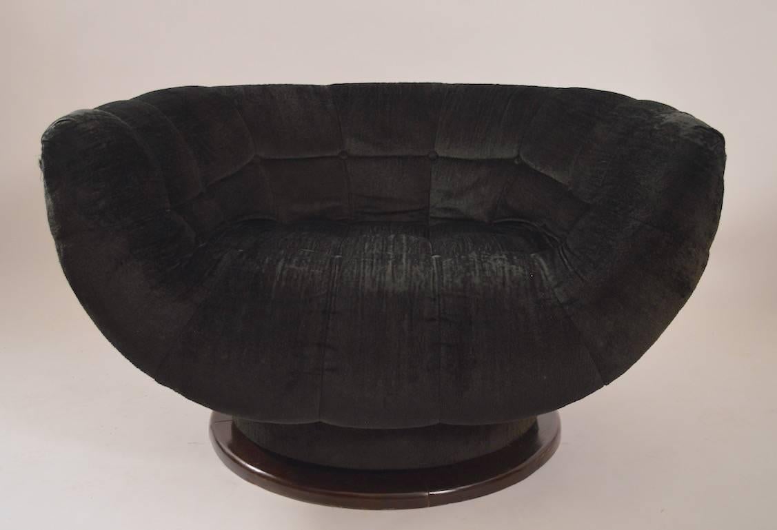 Large swivel lounge chair on pedestal base, by Adrian Pearsall. The chair is tight and sturdy, but the fabric is worn and will need to be replaced.