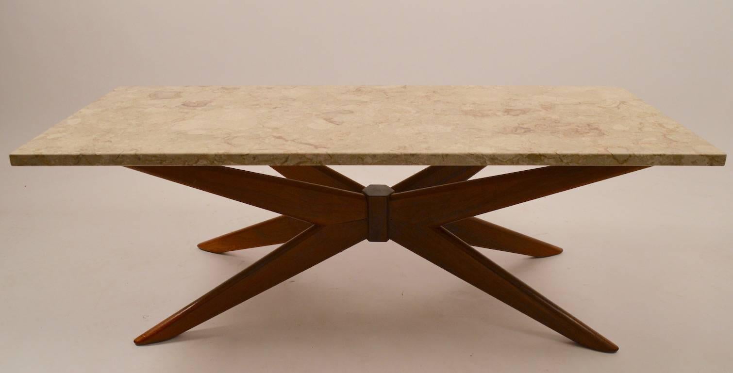 Mid-Century marble-top coffee table with walnut jack form base. The base shows an older repair on the underside (two screws in the leg, as shown), with rectangular marble top. 