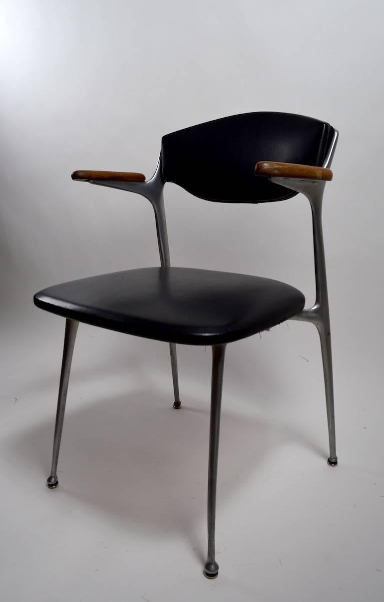 Pair of gazelle aluminium frame, vinyl upholstered chairs, marked 