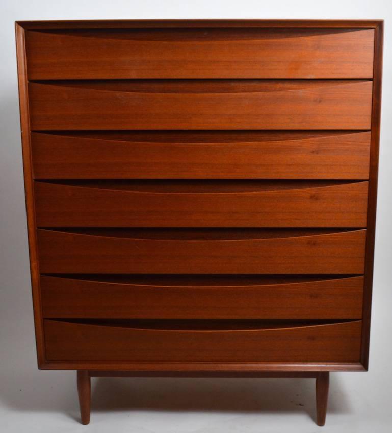 Seven-drawer chest designed by Arne Vodder for Sibast. Elegant and sophisticated Danish Modern teak chest in clean, original condition. The top shows minor cosmetic wear, as shown. Please view the matching dresser and nightstands we have listed from