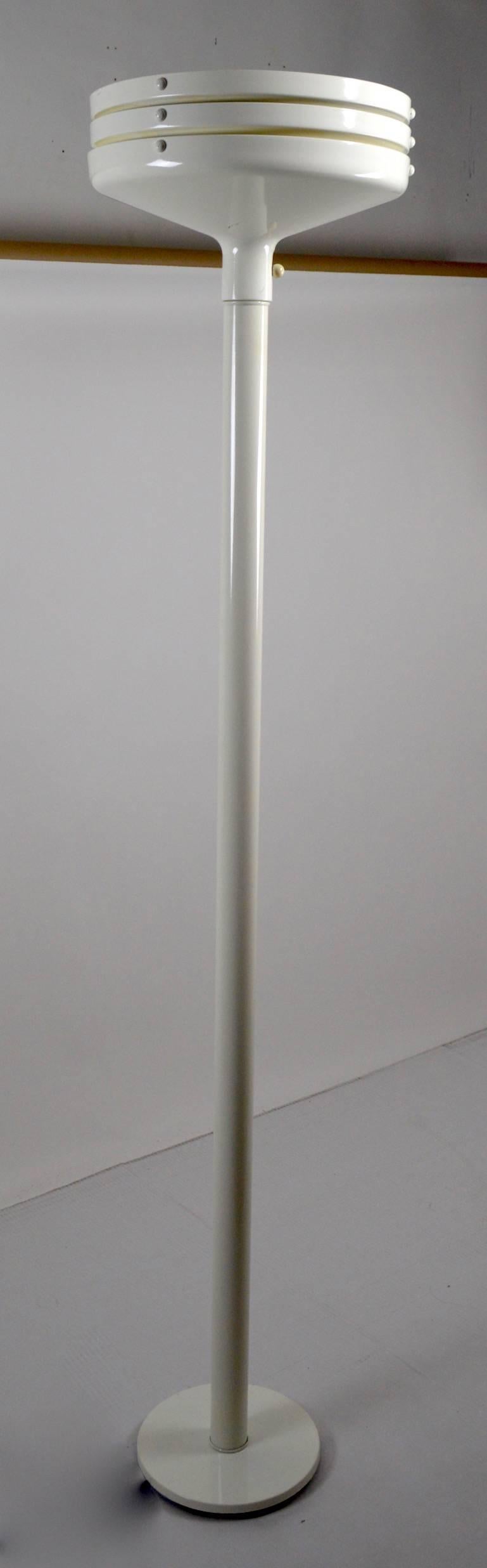 White enameled torchiere probably manufactured by Lightolier. Clean, original, working condition, accepts standard size bulb. Measures: Diameter of base 10.