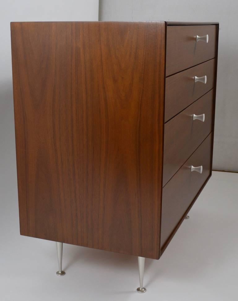 Nice four-drawer George Nelson design for Herman Miller chest, in the sought after Thin Edge series. This example is walnut, and has been professionally refinished and restored.