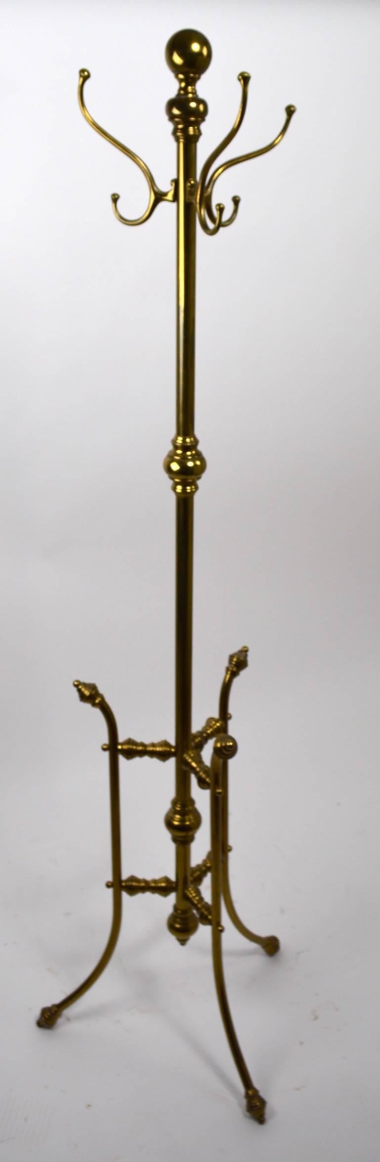 Freestanding solid brass coat tree, with three coat hooks at the top and three leg base.
Fine, original, ready to use condition.