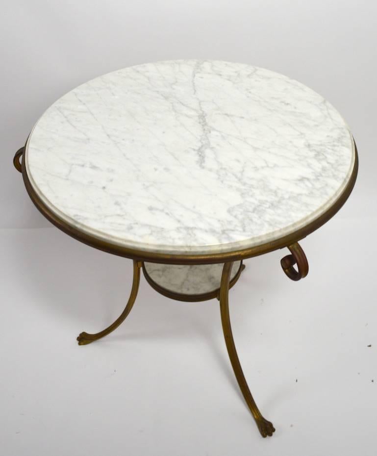 Great quality cast brass frame with two-tier marble surfaces. Excellent original condition, clean, ready to use. Attributed to Maison Baguès, stylish and well-constructed. Large enough to function as a centre table, small enough to use as an end or