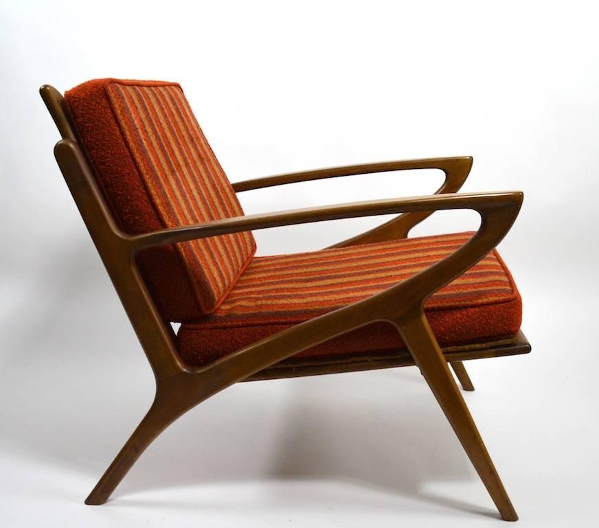 Pair of stylish Mid-Century lounge chairs, Made in Yugoslavia, design influenced by Poul Jensen.
