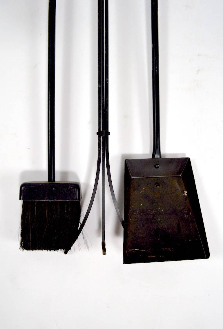 Hard to find wall mount version Donald Deskey fireplace tool set. Wrought iron tools, with brass knife blade handles.