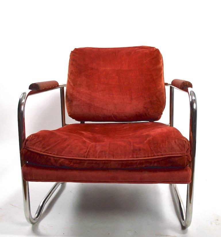 Nice pair of tubular chrome lounge chairs, with original mohair fabric upholstery, fabric shows wear. The chrome cage frame is bright and clean, showing well done seamless weld construction. Chairs are usable as is, or can be reupholstered to taste
