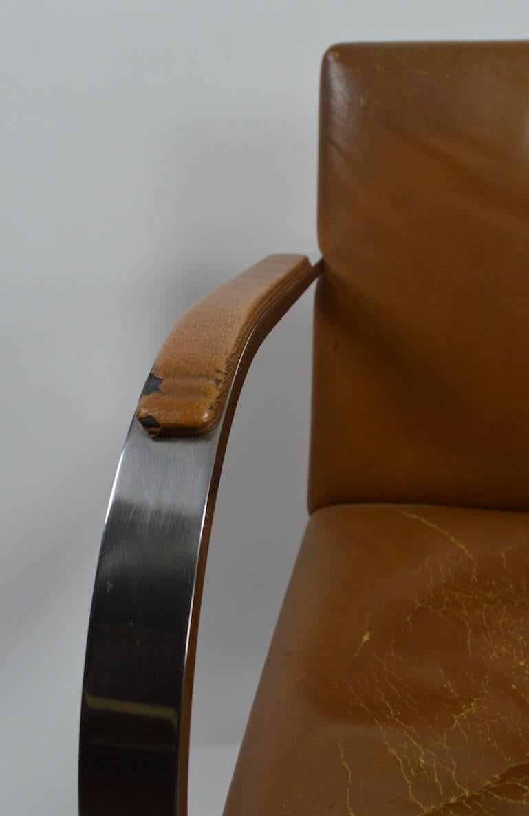 Nice vintage Knoll Brno chairs designed by Ludwig Mies van der Rohe. These chairs retain the 1960s-1970s Knoll 32 Park Ave label, the leather upholstery is as is and will need to be replaced. Arm height 26".
Iconic Modernist chair, timeless