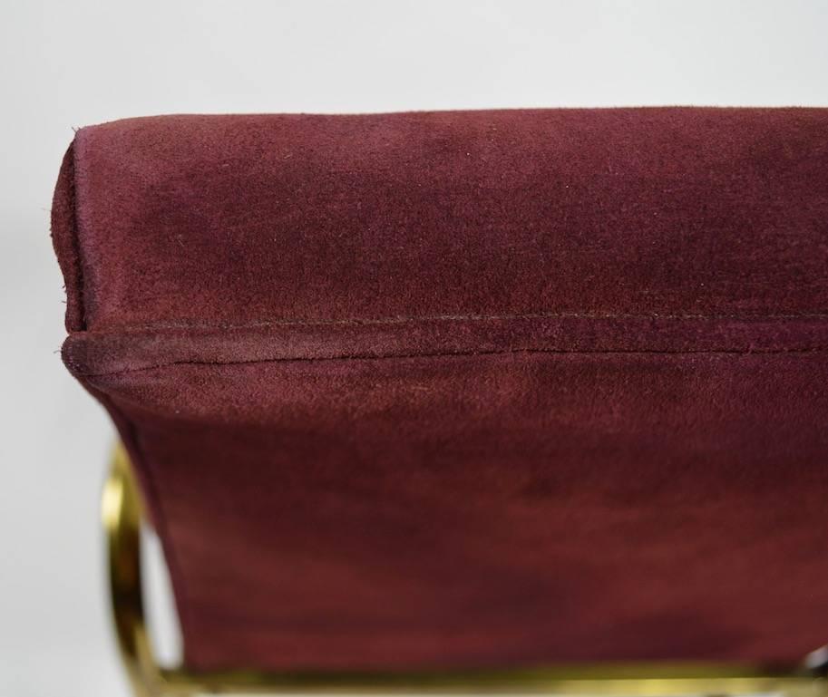 High back brass and suede armchair by Mastercraft. This example is in very good original condition, showing only minor signs of wear, normal and consistent with use.