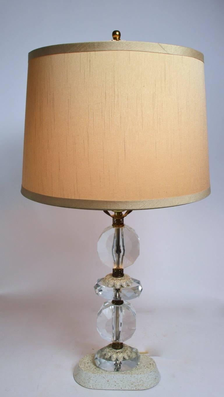 Faceted crystal table lamp base with gold and white cast foliate spacer elements. Clean, working condition original shade and finial included.