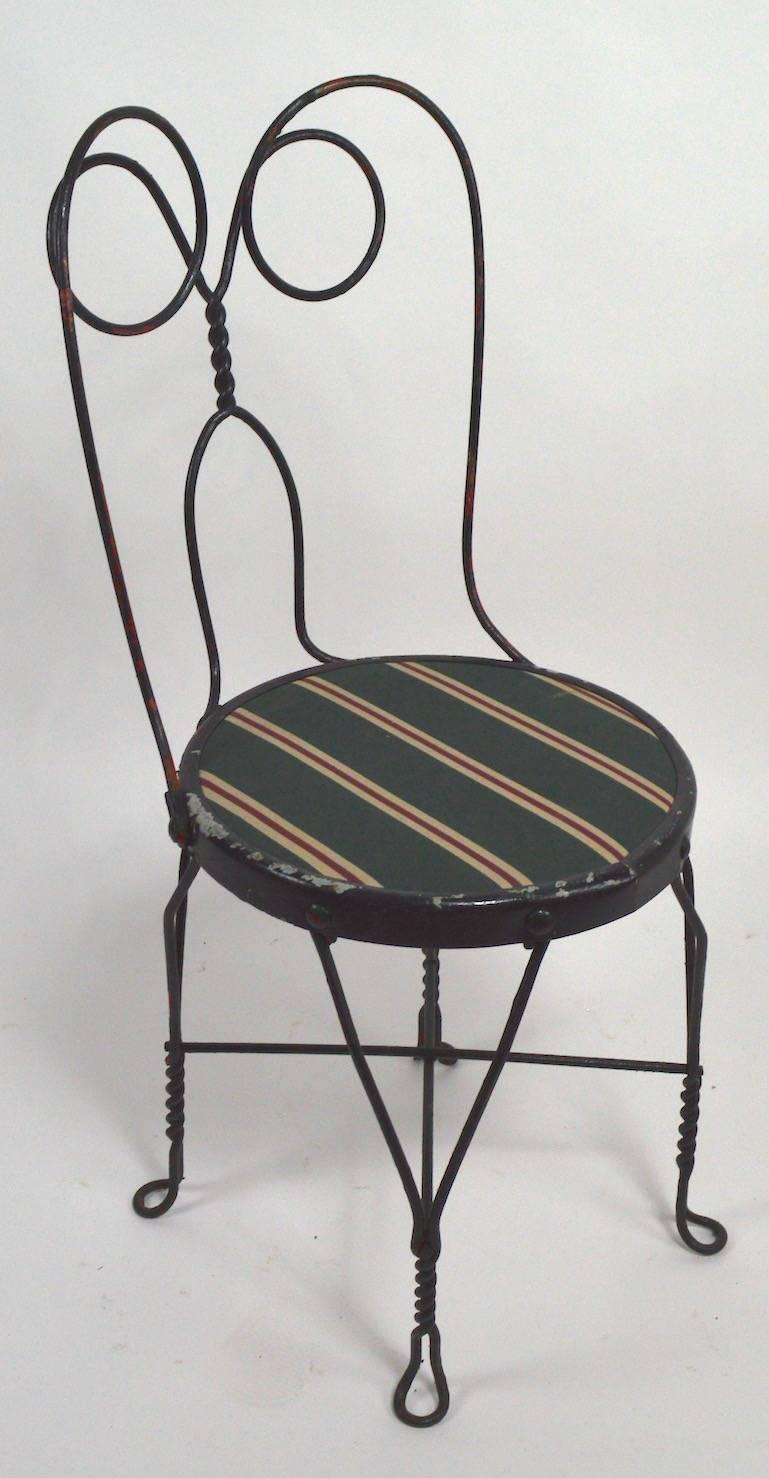 46 ice cream style cafe chairs, originally from the landmark Adelphi Hotel in Saratoga NY. Hand-wrought iron frame with upholstered pad seat, seats show some wear, normal and consistent with age and use. Hard to find nice big sets still intact with