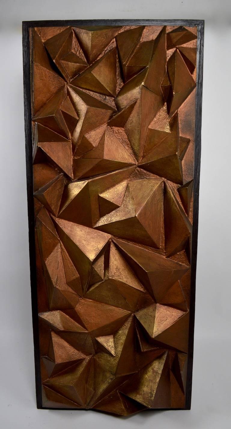 Brutalist fiberglass wall hanging in bronze paint finish, with black trim frame. This wonderful decorative wall hanging sculpture shows both Brutalist and Cubist influences Interesting and unusual item, clean ready to hang condition.