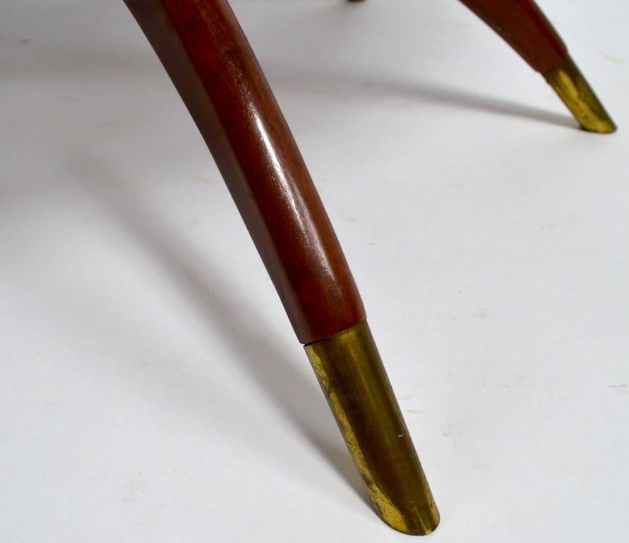 Interesting brass tray top table with folding mahogany spider leg base. Probably Moroccan in origin, circa 1950s or 1960s.