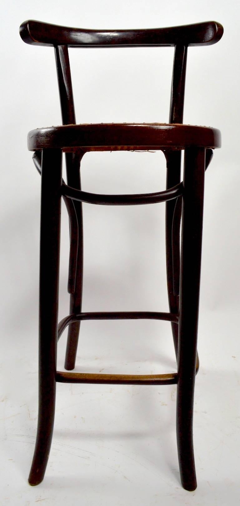 Pair of J J Kohn and Mundus bentwood stools made in Czechoslovakia, in the Vienna Secessionist style, after Thonet. These stools were originally found in Rileys Lake House, a notorious Saratoga NY speakeasy. Please view then other pair we have
