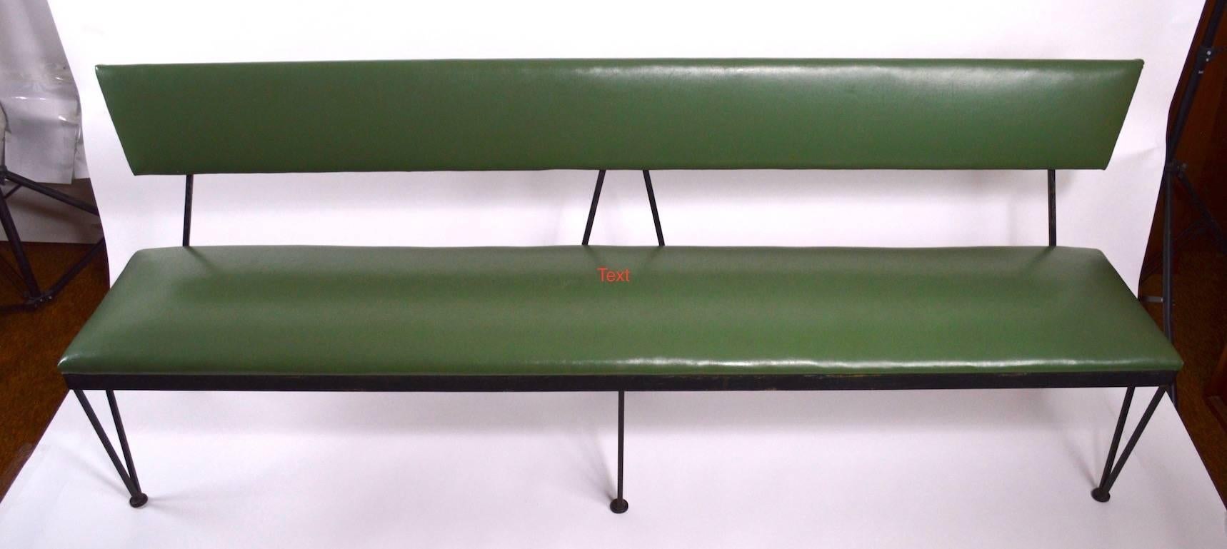 Extra long wrought iron and vinyl bench, clean, original and ready to use.
 Design after Umanoff or Weinberg, well constructed, heavy and solid.
 Please view the matching, but shorter bench we have listed.