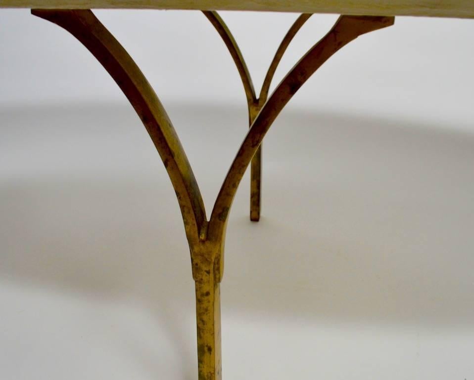 Oval marble top coffee, cocktail table with Brutalist style brass legs. Wonderful large-scale makes this an impressive statement table. Probably Italian made, period Mid-Century example. Marble .75