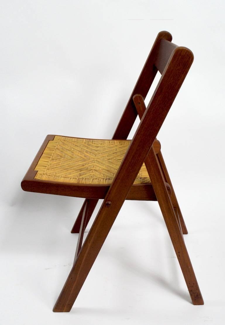 Scandinavian Modern Set of Four Danish Modern Folding Chairs of Solid Teak and Cane