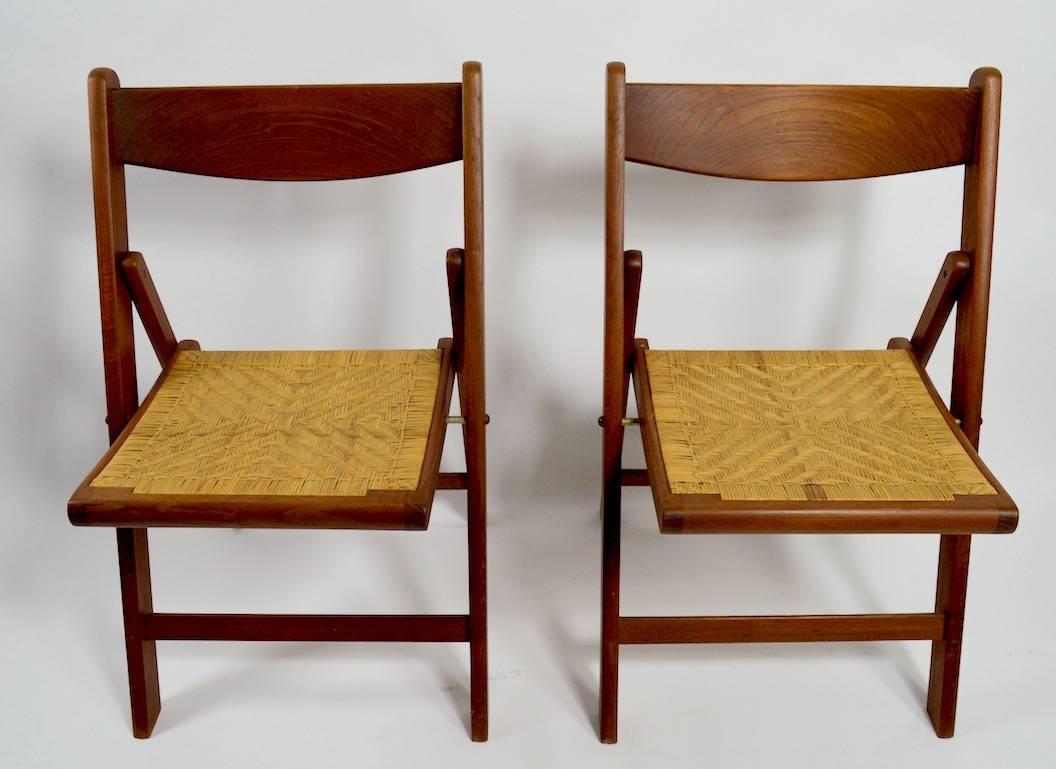 Set of Four Danish Modern Folding Chairs of Solid Teak and Cane 4
