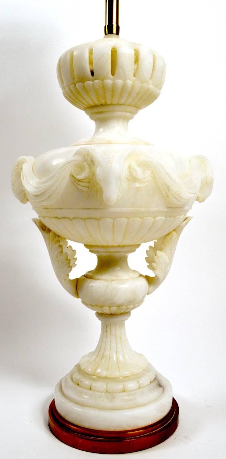 Unusual; and extra-large carved alabaster lamp by Marbro, in original and working condition. This lamp has carved animal head details, as well as swags and pierced opening details. Hard to find this scale, impressive and well detailed. Shade not