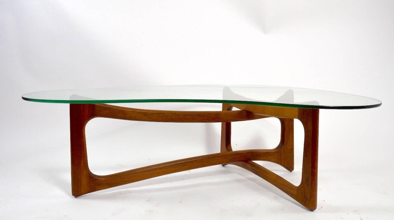 Iconic Mid-Century design free-form glass top coffee table, designed by Adrian Pearsall for Craft Associates. 
 The glass top shows some surface scratching which is normal and consistent with age for this type of table.