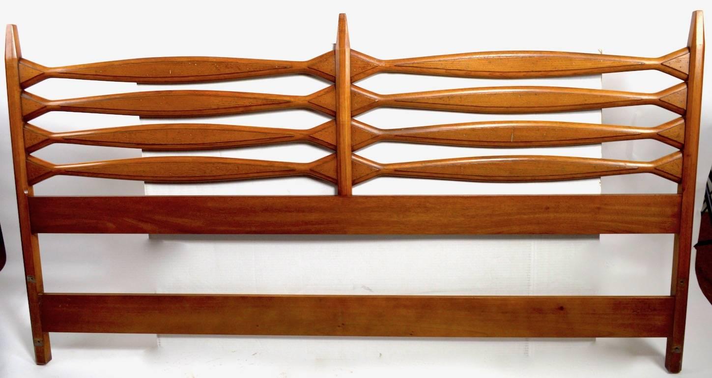 Midcentury full size headboard with architectural open work decorative wood horizontal elements.