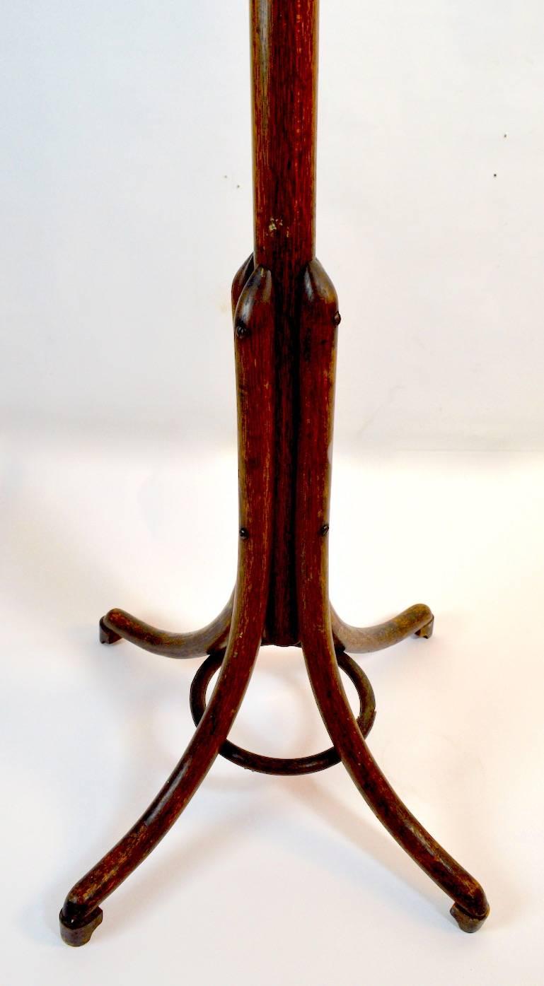Interesting bentwood coat stand, attributed to Thonet. This example shows very minor restoration (replaced screw as shown) and minor splits in some the bentwood elements, normal and consistent with age.