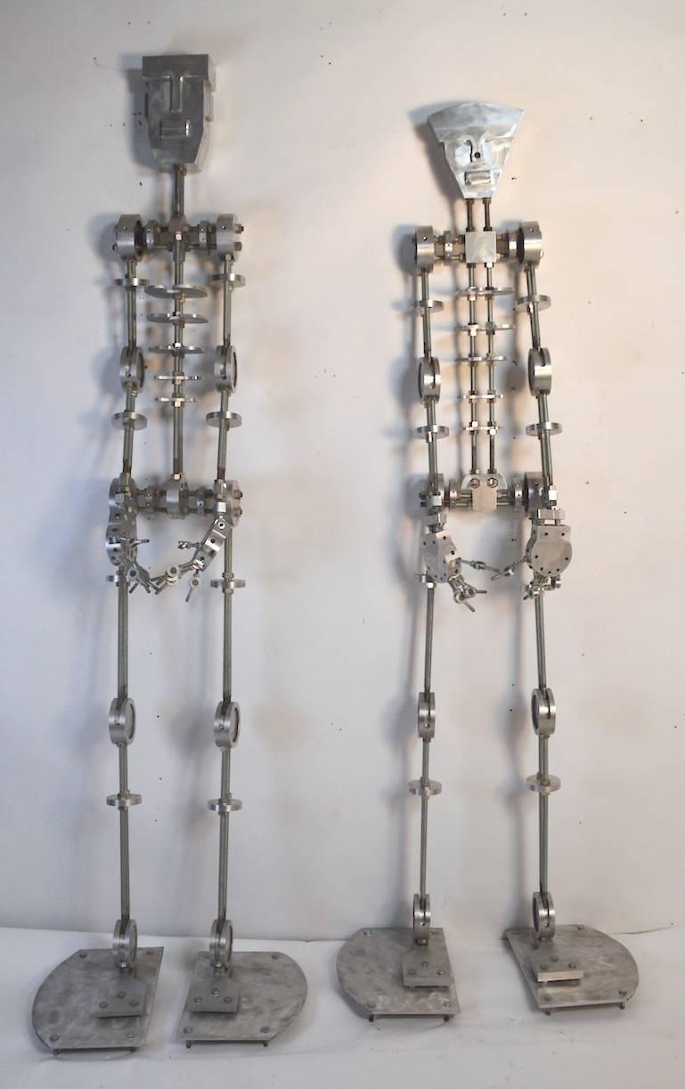 Insane machined aluminium and steel man and woman by a NYC based artist, circa 1980s. Each figure has aluminium 
