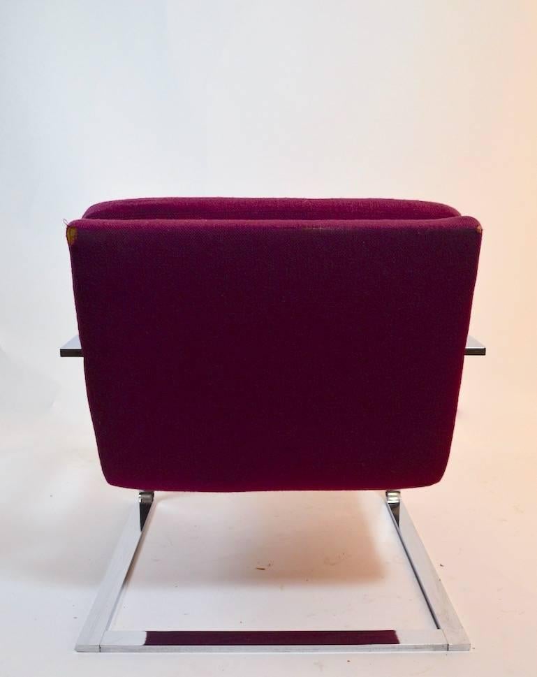 Great quality chrome lounge chairs, cantilevered solid flat bar construction, heavy well made and stylish. These chairs will need to be reupholstered. We believe these are probably Pace, Brueton, or another top shelf furniture manufacturer -