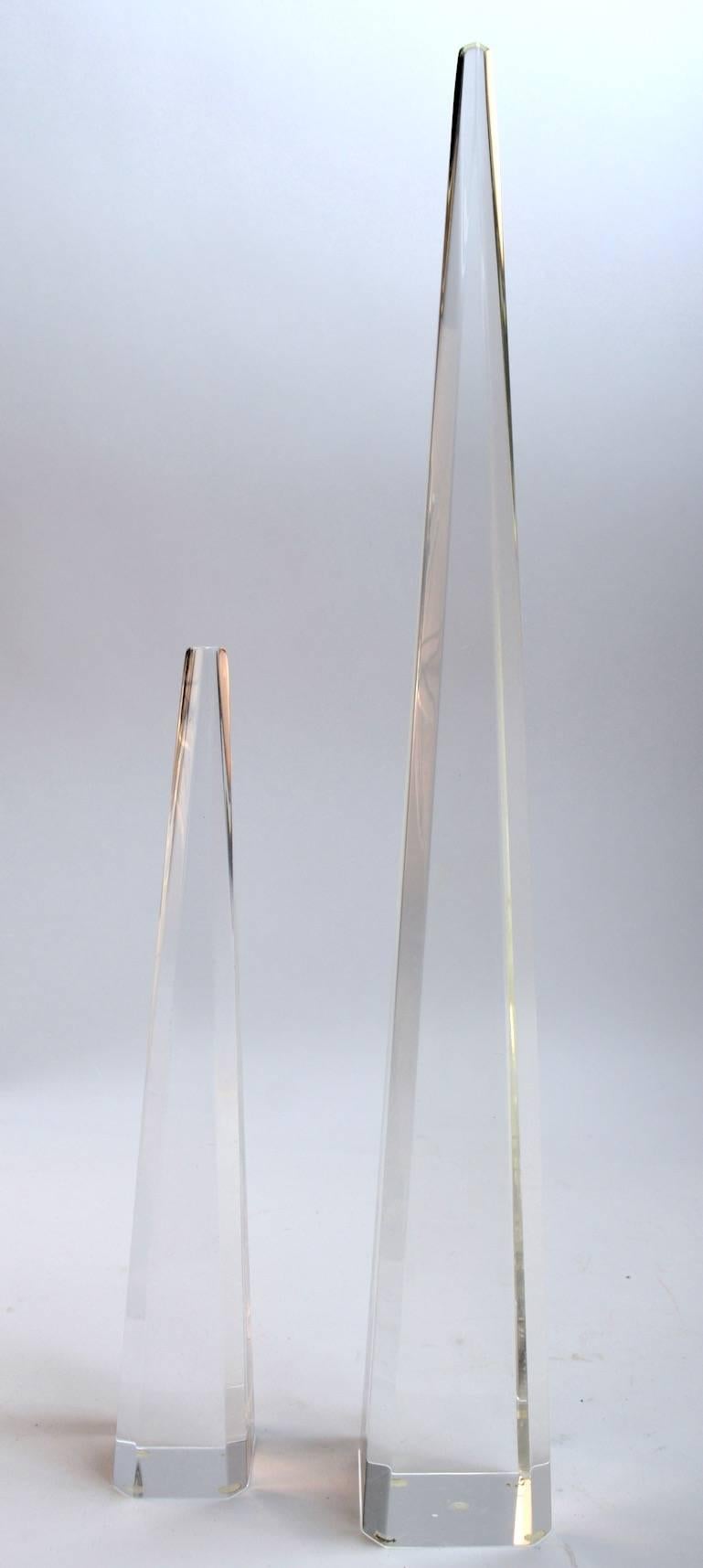 Two Lucite obelisks both in clean, original condition. Measures: Tallest 19.5
