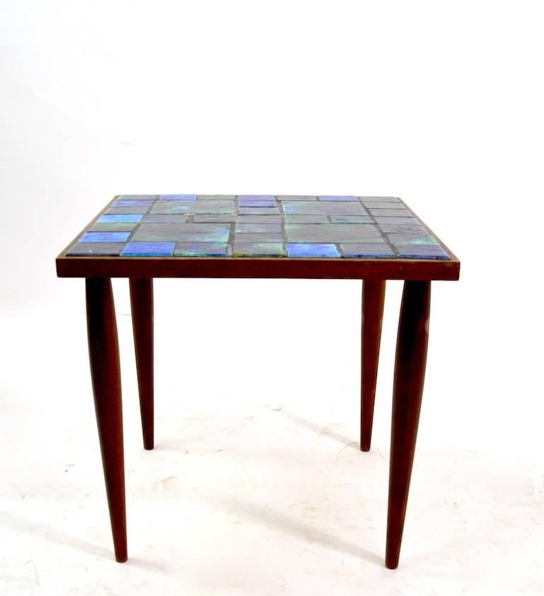 Matched pair of mosaic top tables by Georges Briard. Overall very fine condition, one tile shows minor loss, as shown. Selling and priced as a pair.