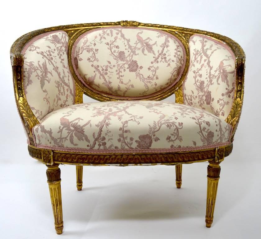 Pair of gilt frame Salon chairs in the Louis XVI style. The gilt shows the normal and expected wear and loss, consistent with age. We believe these examples are late 19th century vintage. Seat H 16.