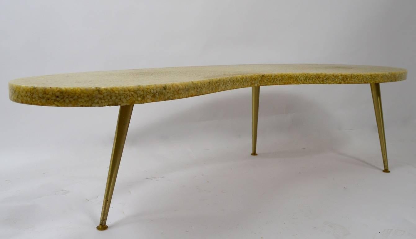 Amoeba shaped resin with pebble insert, on tapered pole metal legs. Chic and stylish Classic American Mid-Century Modern form. 
original, clean, ready to use condition.
 