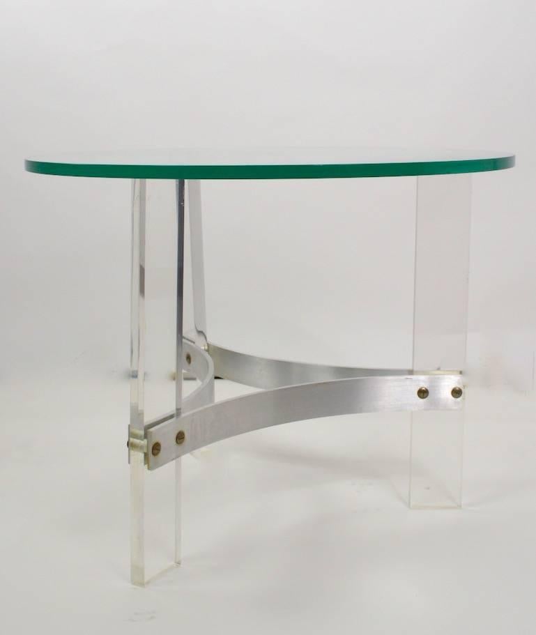  Elegant three Lucite legs with an aluminum stretcher base supports the original plate glass top (.5 inch thickness ). Design by Charles Hollis Jones.
Original, clean, ready to use condition.
 