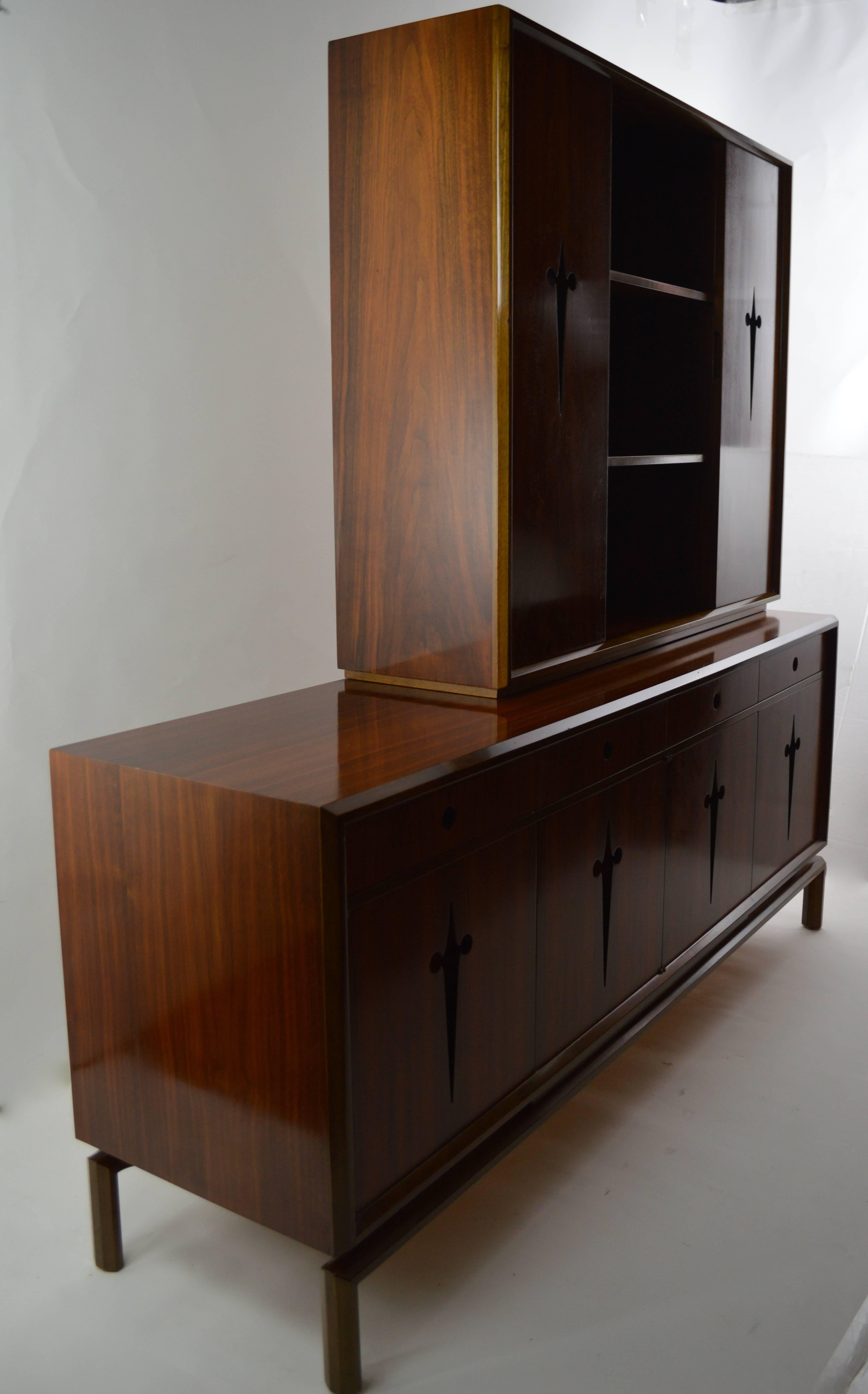 Chic and elegant credenza designed by Edmund Spence. This example is in very good original condition, clean and ready to use. Top is movable and removable, however there is a shadow where it sits, as it has been in position since the mid-20th