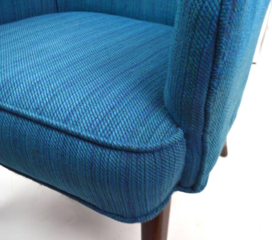 Exact match in dimensions, however different fabric on each chair. Both chairs  show some cosmetic wear to fabric, usable as is or we also offer upholstery services. Measures: Seat height 16.5 inches, arm height 24.
 Offered and priced individually,