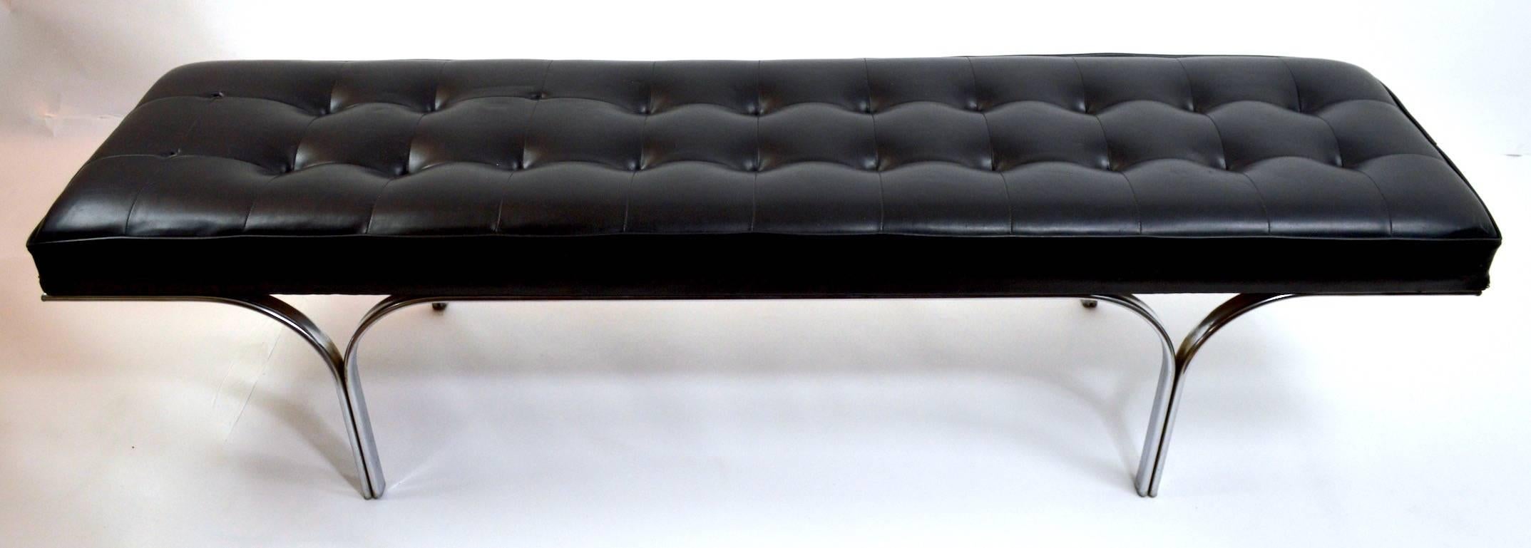 Stylish chrome leg upholstered top bench. The vinyl top shows wear, usable as is or reupholster to taste.
