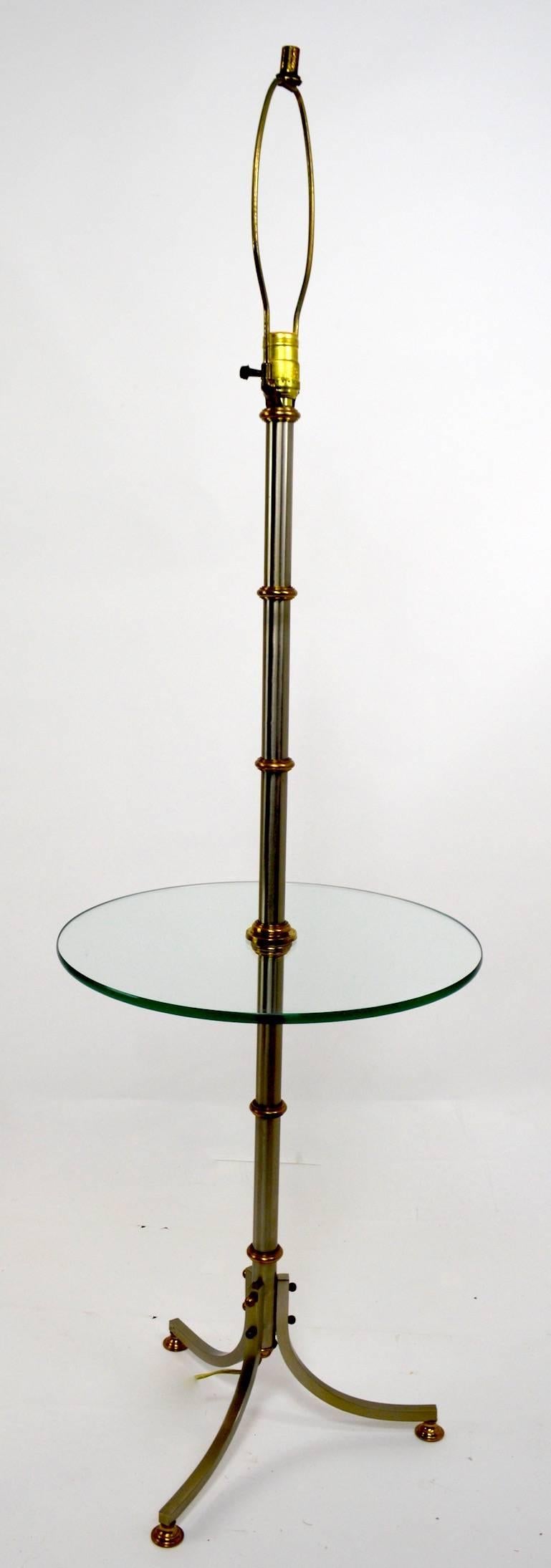 Floor lamp with glass shelf after Maison Jansen. Measures: Shelf height 21.5 inches, shelf diameter 16 inches.