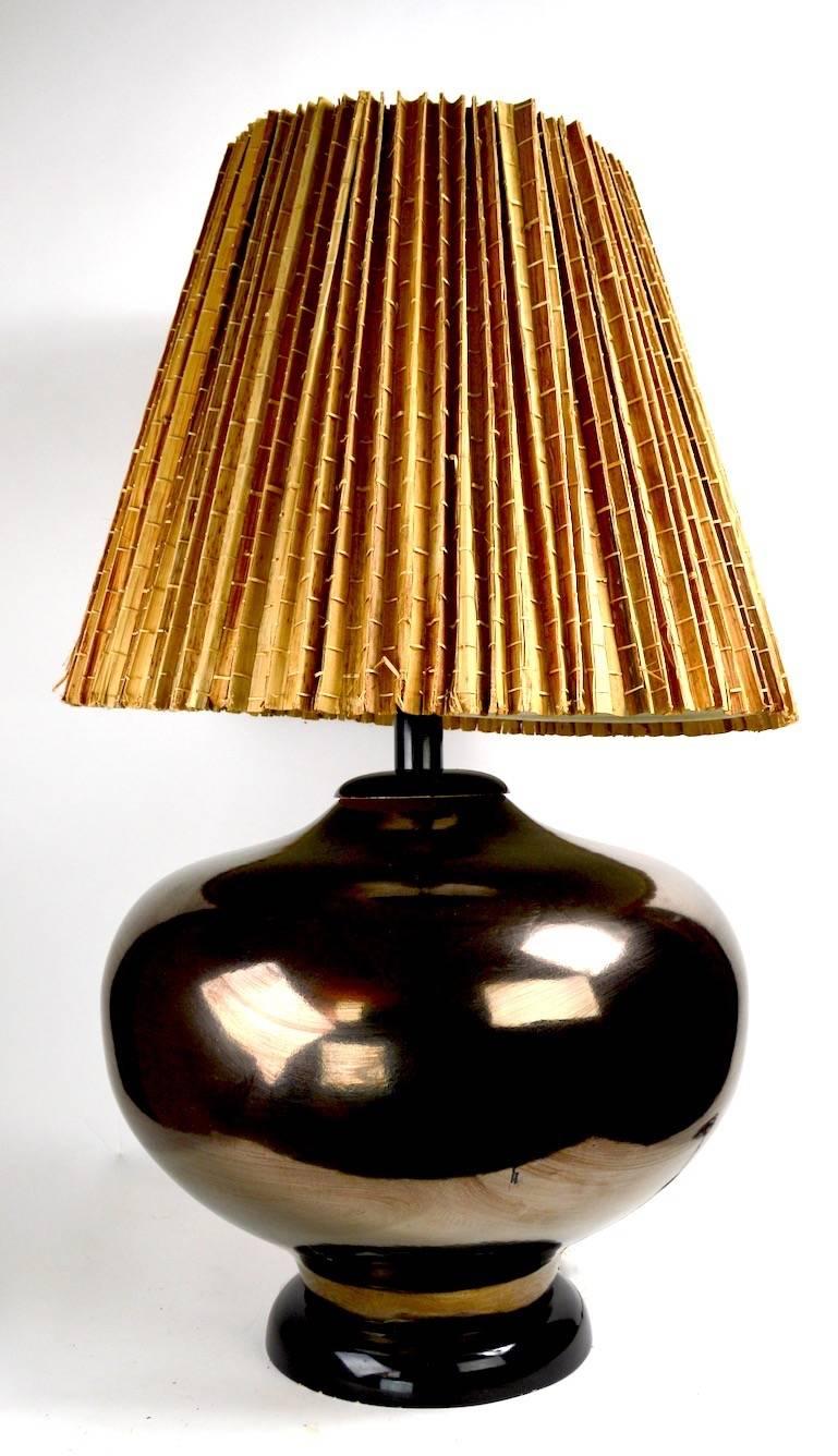 Impressive metallic glaze ceramic table lamp, mid century production, with obvious Chinese influence. Original, clean, working condition, shade not included.
Well made, and very heavy, this lamp will make a statement en situ. Height to top of