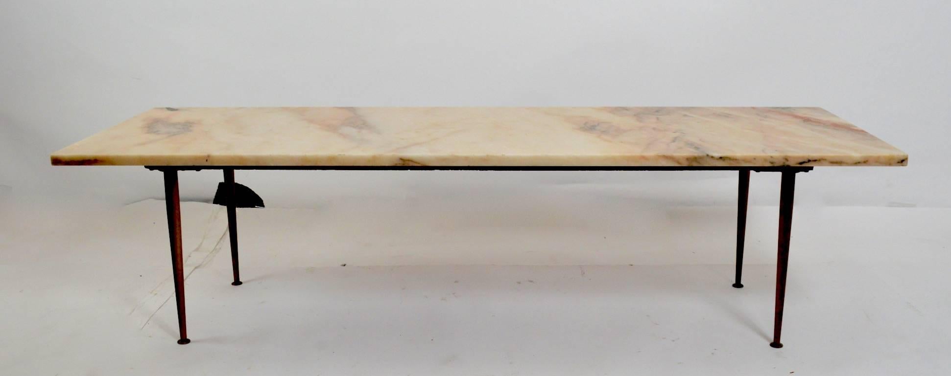 Rectangular marble-top coffee table with solid cast brass legs, probably Italian made, circa 1950-1960s. Measure: Marble 1 inch thick.