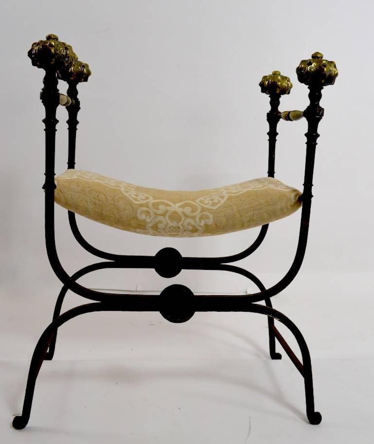 Great pair of folding Italian Savonarola Curule bench seat chairs. Both are in very Fine original condition, with exception of seats, which have later upholstery. Wrought iron frames with large and impressive brass knob finials. Hard to find the