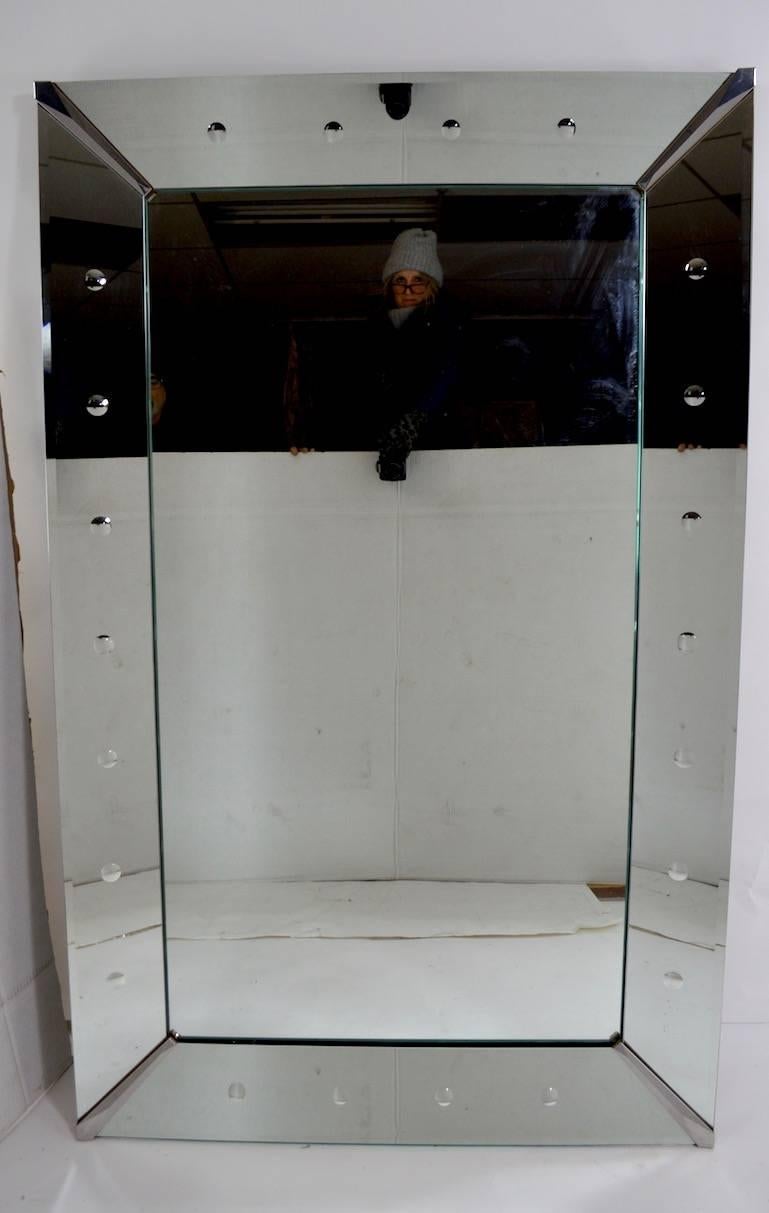 Art Deco plate glass mirror framed by dot motif mirrored trim. Original, clean ready to use condition, currently configured to hang horizontally, but can easily be reconfigured to hang vertically. Each side mirror approximately 5 7/8 inch wide.