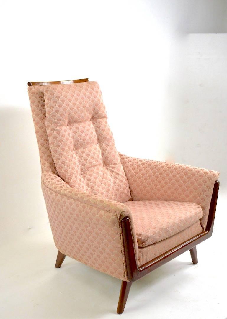 High back lounge chair by Rowe in the style of Pearsall.This example is in very good condition, however has been reupholstered in later pink scalloped fabric. Measures: seat 16 x arm H 22.