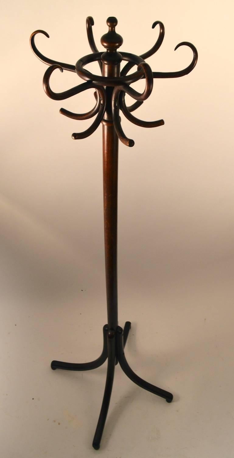 Steam bent wood coat tree in the Secessionist School. This period example still retains the original paper label, as shown. Six arm top, swivels to facilitate hanging and accessing your garments. Wonderful original condition. Top element 10