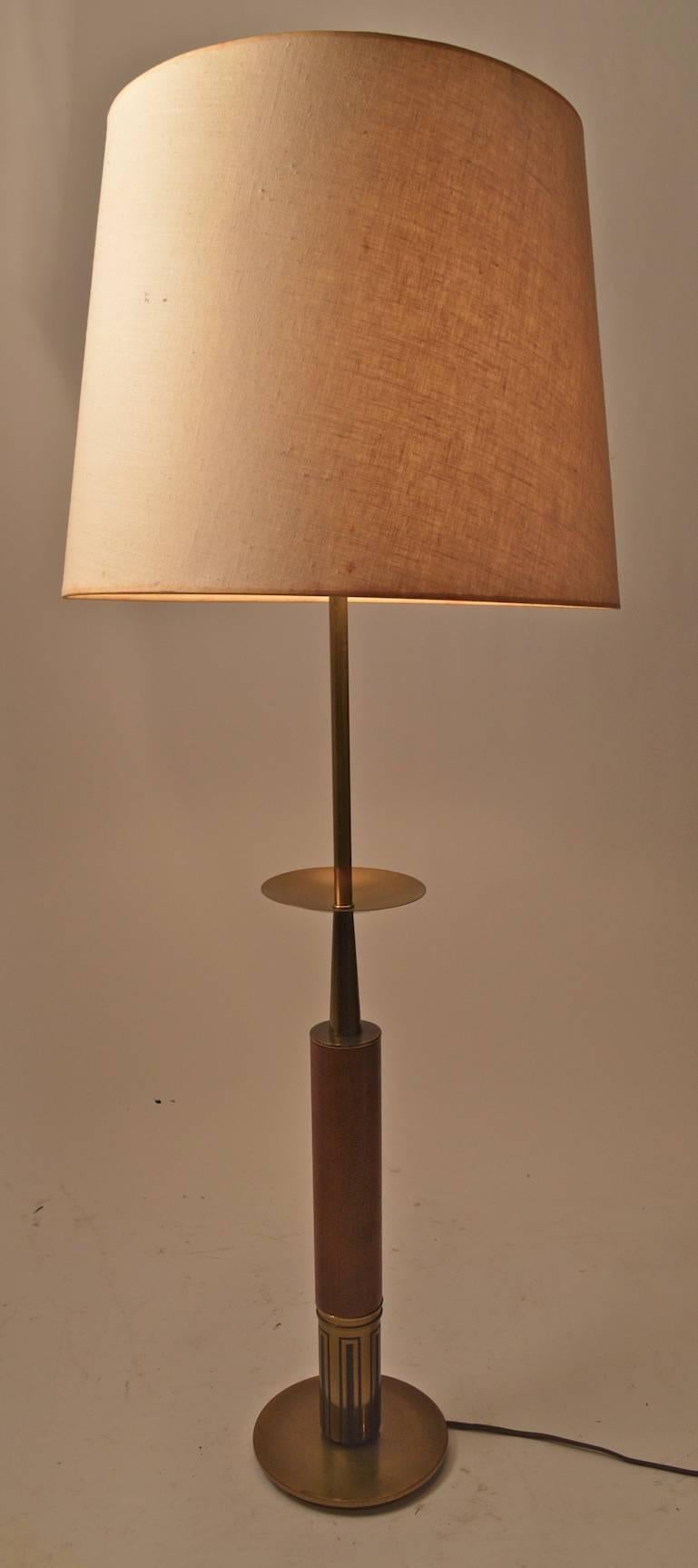 Walnut and brass table lamp, design after Parzinger. Height to brass disk 22.5
